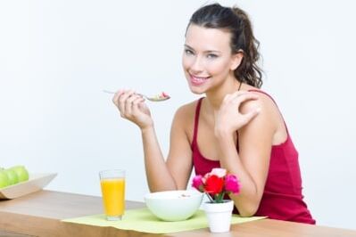 The girl is eating a salad